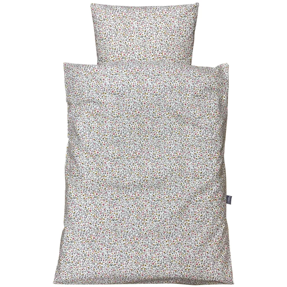 Småblomstret sengetøj lys